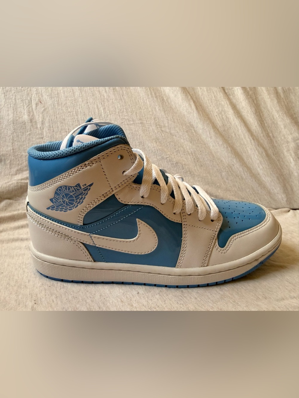Air Jordan 1 Mid University Blue and White Sneakers